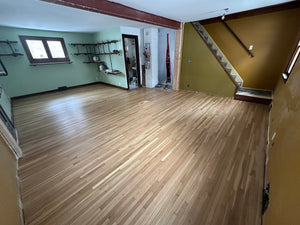 Basement Remodel Wood Flooring & Corner Fireplace Tile Wall