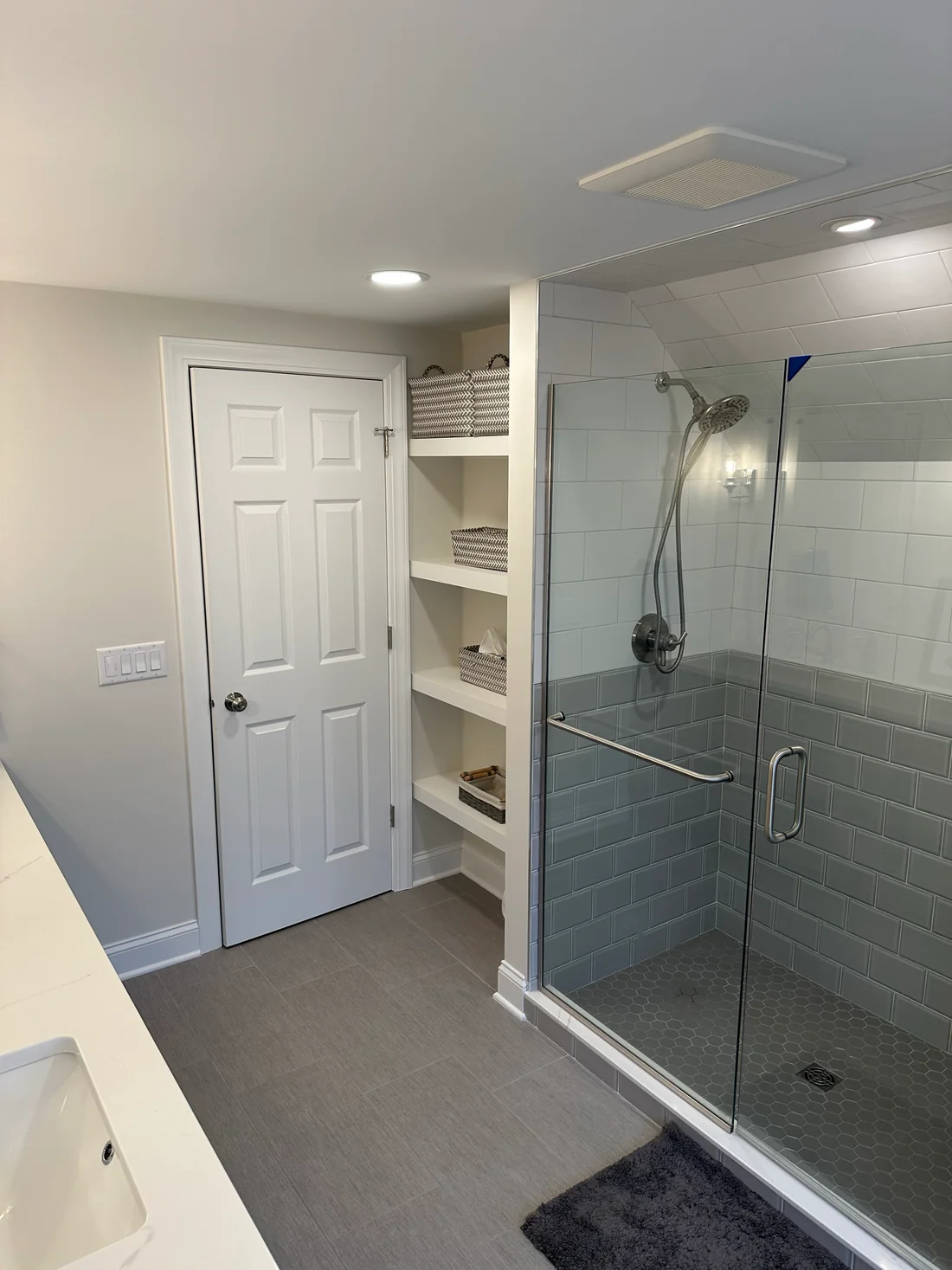 MEtro REmodling Updated Bathroom - Extra Storage Glass Door Shower W: Medium To Large Subway Tile & Large Format Flooring3