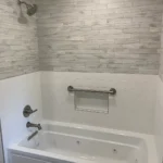 Metro REmodling Tub Shower Combo W: Accent Lighting On Wood Appearance Tile