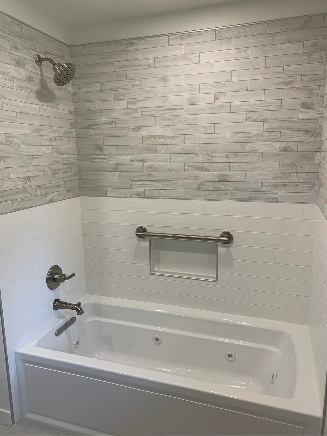 Metro REmodling Tub Shower Combo W: Accent Lighting On Wood Appearance Tile