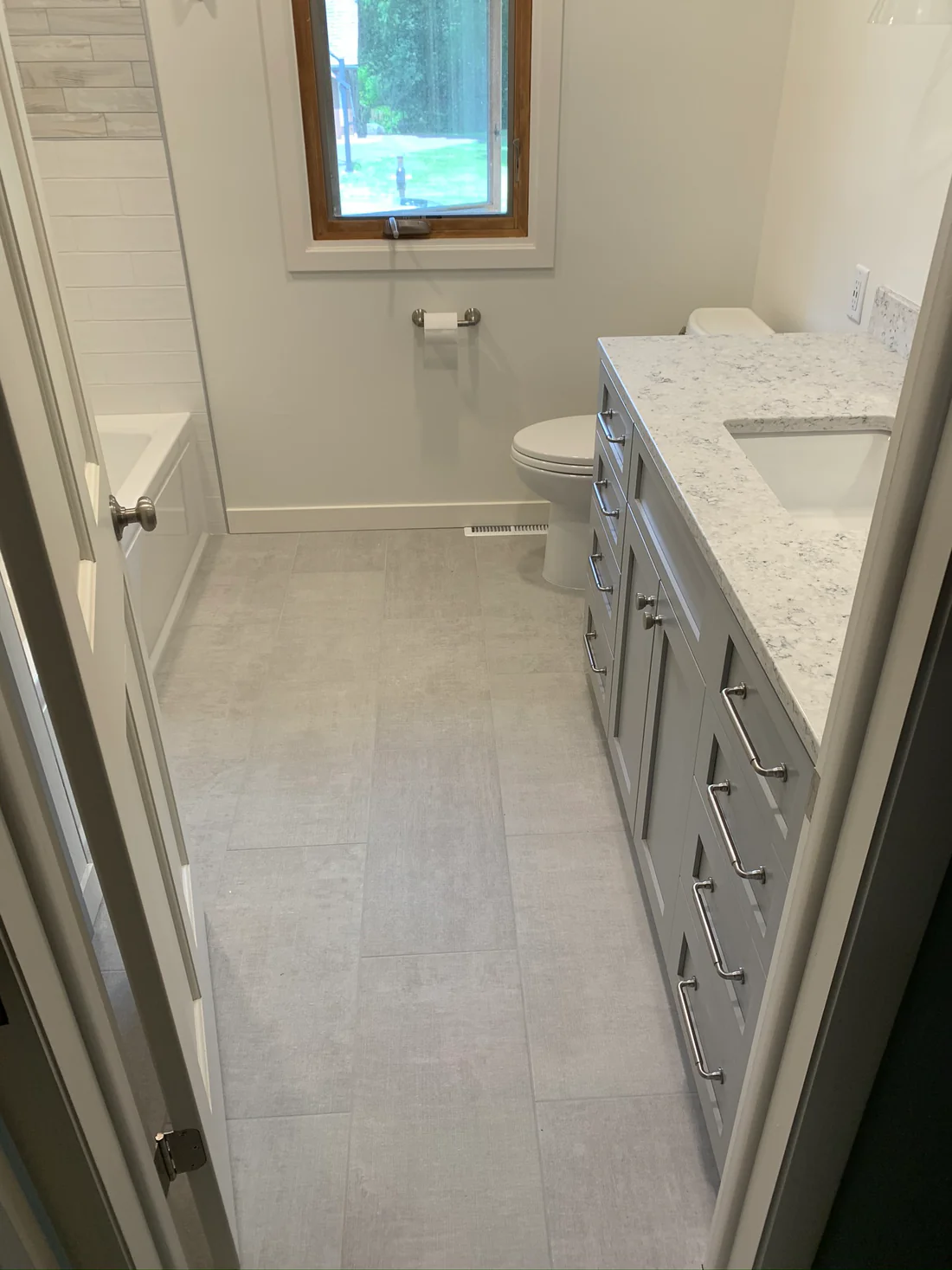 Metro REmodling Tub Shower Combo W: Accent Lighting On Wood Appearance Tile2