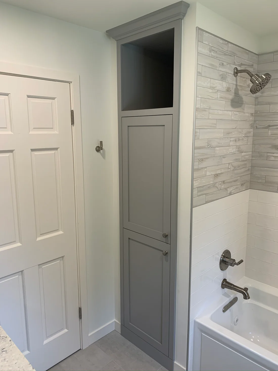 Metro REmodling Tub Shower Combo W: Accent Lighting On Wood Appearance Tile3