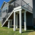 Metro Remodeling Brown Mid-Level Composite Decking W Stairs And Gate