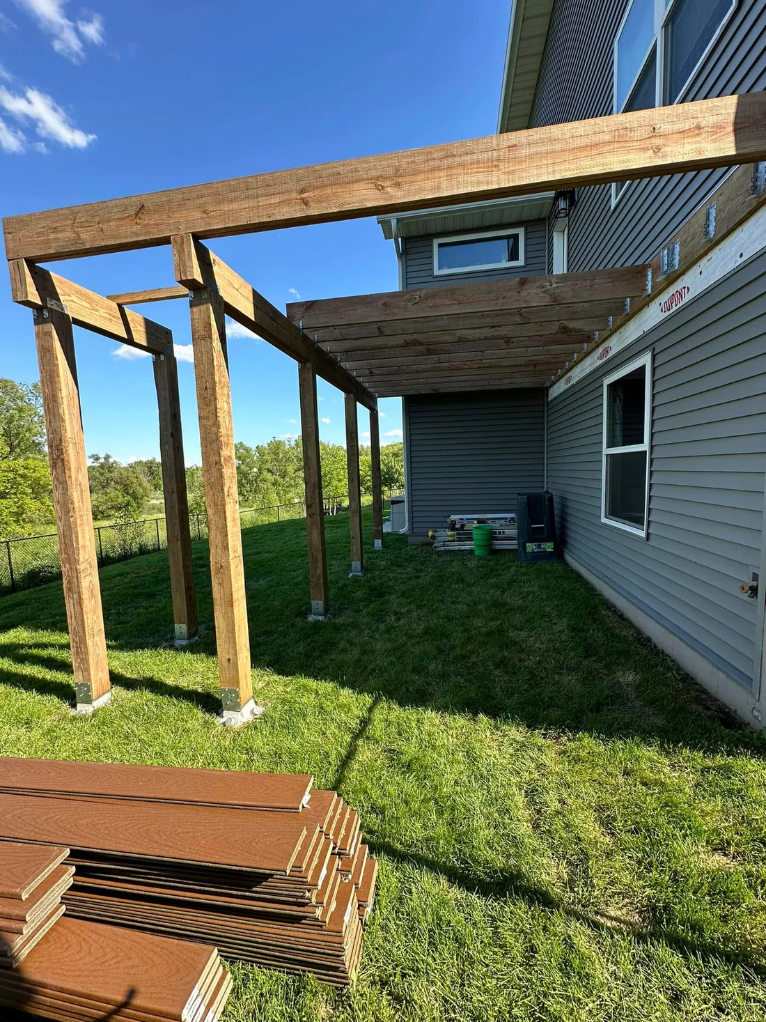 Metro Remodeling Brown Mid-Level Composite Decking W Stairs And Gate11