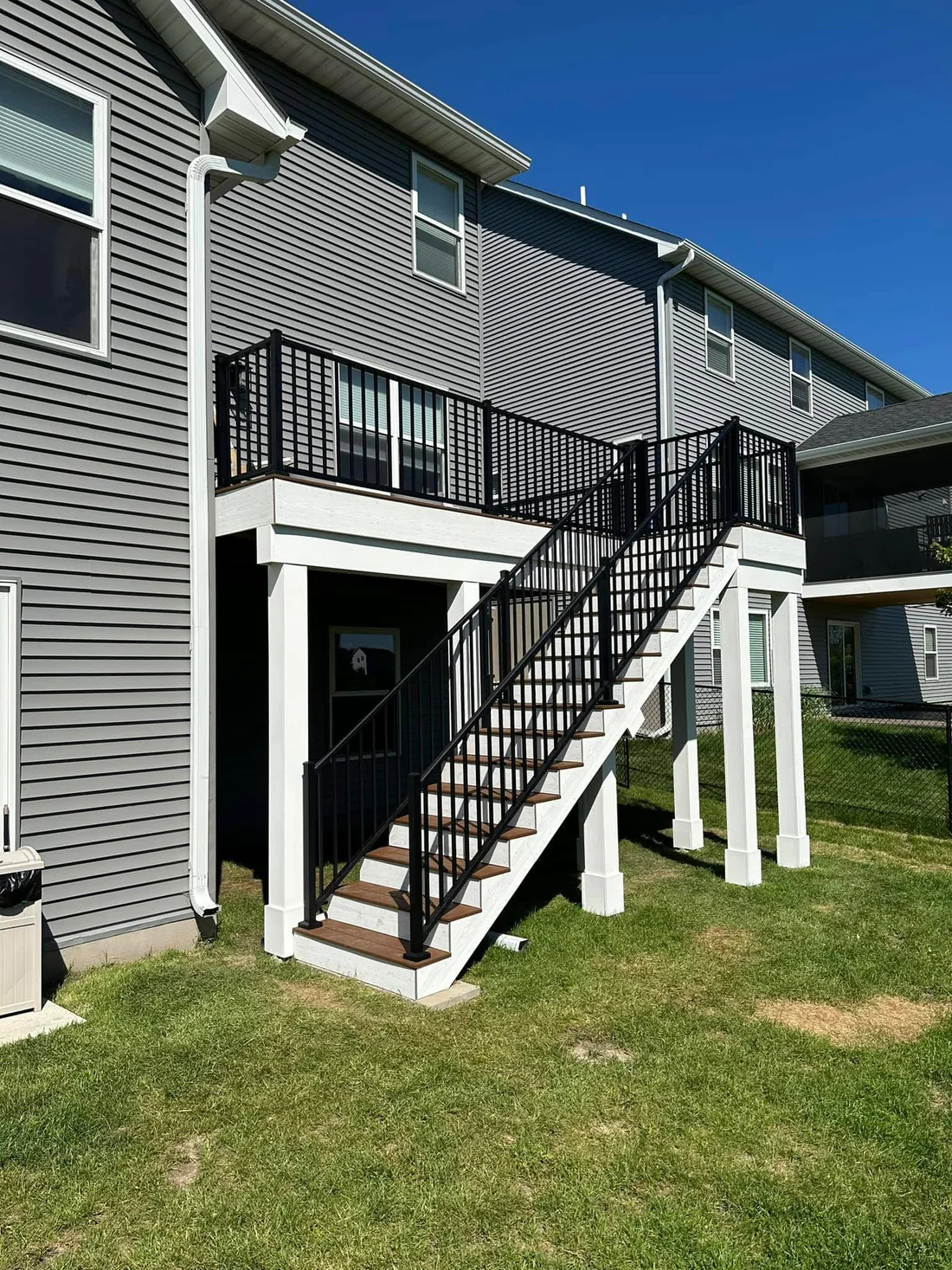Metro Remodeling Brown Mid-Level Composite Decking W Stairs And Gate2