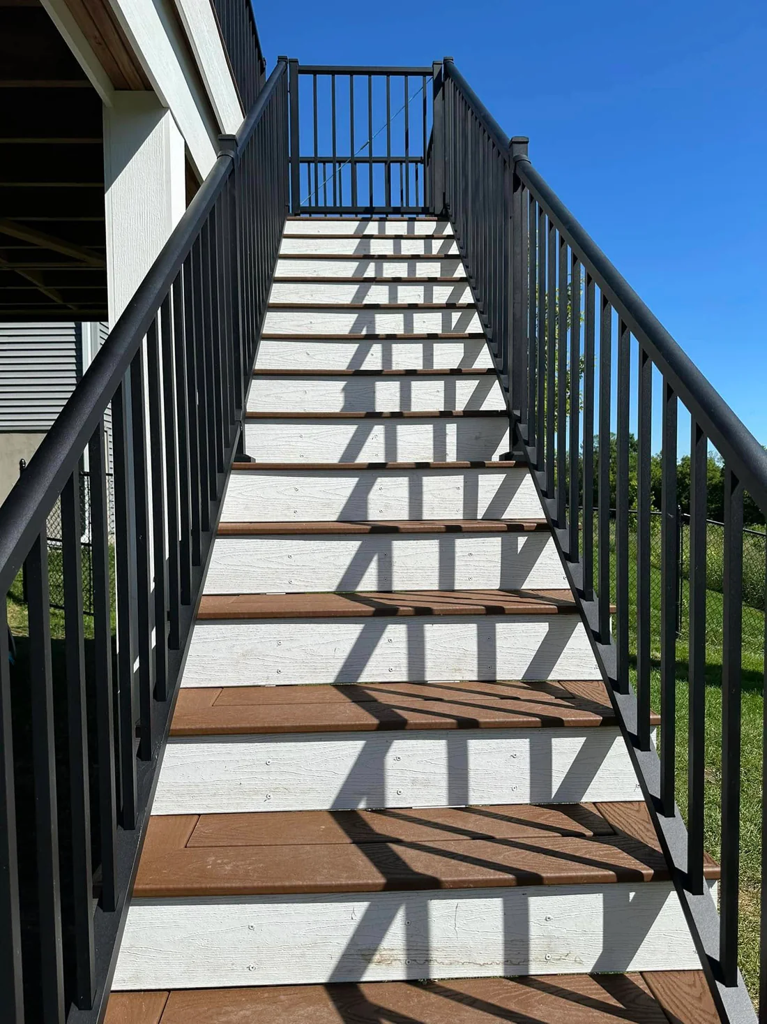 Metro Remodeling Brown Mid-Level Composite Decking W Stairs And Gate7