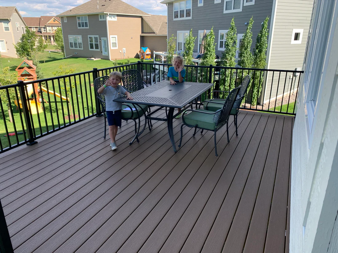 Metro Remodling White & Brown Mid-Level Composite Decking With Stairs
