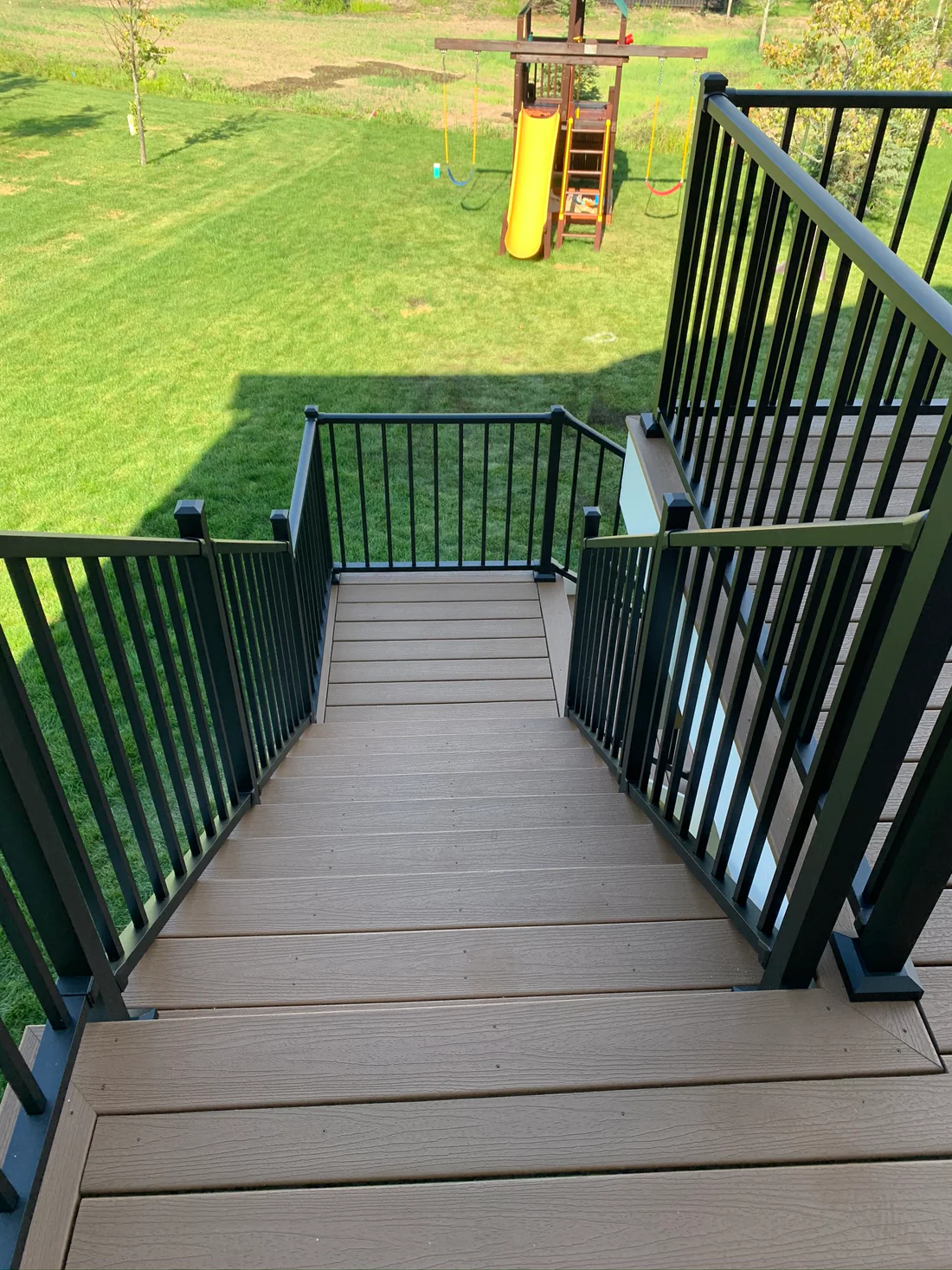 Metro Remodling White & Brown Mid-Level Composite Decking With Stairs6